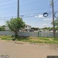 Officer checks junkyard vehicle with expired plate
