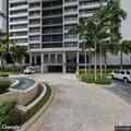 Person experiencing back pain at Naples apartment