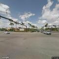 Traffic light stuck on red near restaurant