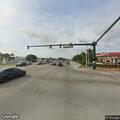 Traffic stop on green Toyota near restaurant