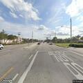 Pedestrian trapped under vehicle on South Jog Road