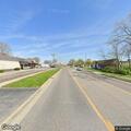 Van broken down in roadway near gas station