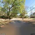Pedestrian walking in middle of Pinecrest Street