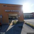 Officer with victim and person in custody at hospital