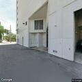 Person laying in parking lot near car wash in Sarasota