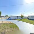 Person experiencing abdominal pain at mobile home park