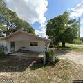 Person sleeping on porch of vacant Vero Beach house