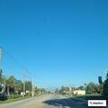 Driver in black sedan swerving off the road