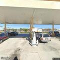 Wallet stolen at gas station, weapons mentioned