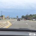 Slow vehicles with flat tire block lane on East Bay