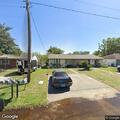 Man in yard with bat threatening woman