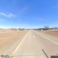Grass fire near buildings on West Highway 277