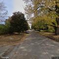 Branch from truck blocking roadway on 18th Street