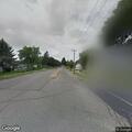 Dog running in road on Milwaukee Street