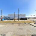 Vehicle hits light pole in store parking lot