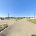 Woman standing in roadway at 4th and Esperanza