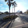 Two-vehicle crash in store parking lot, no injuries