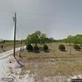 Propane tank struck and leaking gas at rural address