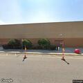Water pipe leaking behind building at highway address