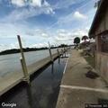 Vehicle overturned against dock at river access