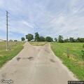 Deceased deer blocking lane on County Road 26