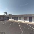 Person experiencing abdominal pain at motel
