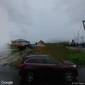 Traffic stop on orange Nissan Sentra near floodgate