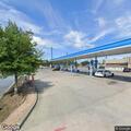 Men selling stereo equipment from truck at Circle K