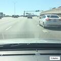 Officer standing by with vehicle on shoulder