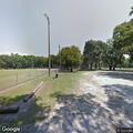 Dirt bike and pickup doing donuts in downtown Micanopy