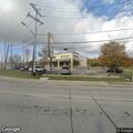 Officer checks suspicious vehicle at cash store