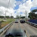 Traffic stop on gray Nissan Altima at bridge