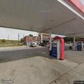 Couple arguing outside gas station by freeway
