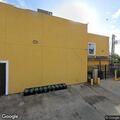 Person looking into cars at restaurant parking lot