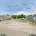 Suspicious man under church carport on North Alexander