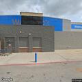 Injured deer blocking roadway near Walmart
