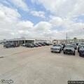 Alarm and vehicles at car dealership lot