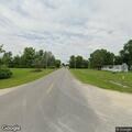 Person walking in roadway at Highway E