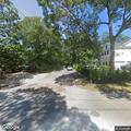 Backyard brush fire in Westhampton neighborhood