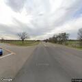 Person reporting theft at highway intersection
