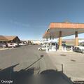 Suspicious people in gray car at gas pump