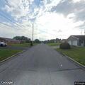 Truck pulls down cable line, street blocked near house