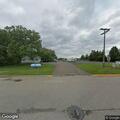 Pickup truck stopped on railroad tracks near home