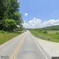 Unsafe black Ford truck on Old Rosman Highway