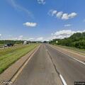 Officer checks abandoned vehicle on interstate