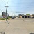 Male lying on ground near parking lot at 17th and Racine