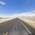 Loose cow blocking traffic on Wyoming Highway 34