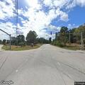 Welfare check on man lying in grass at Louisburg Rd