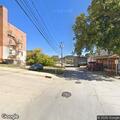 Woman walking barefoot and acting strangely on Julius St