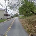 Smoking utility pole and wires reported at intersection